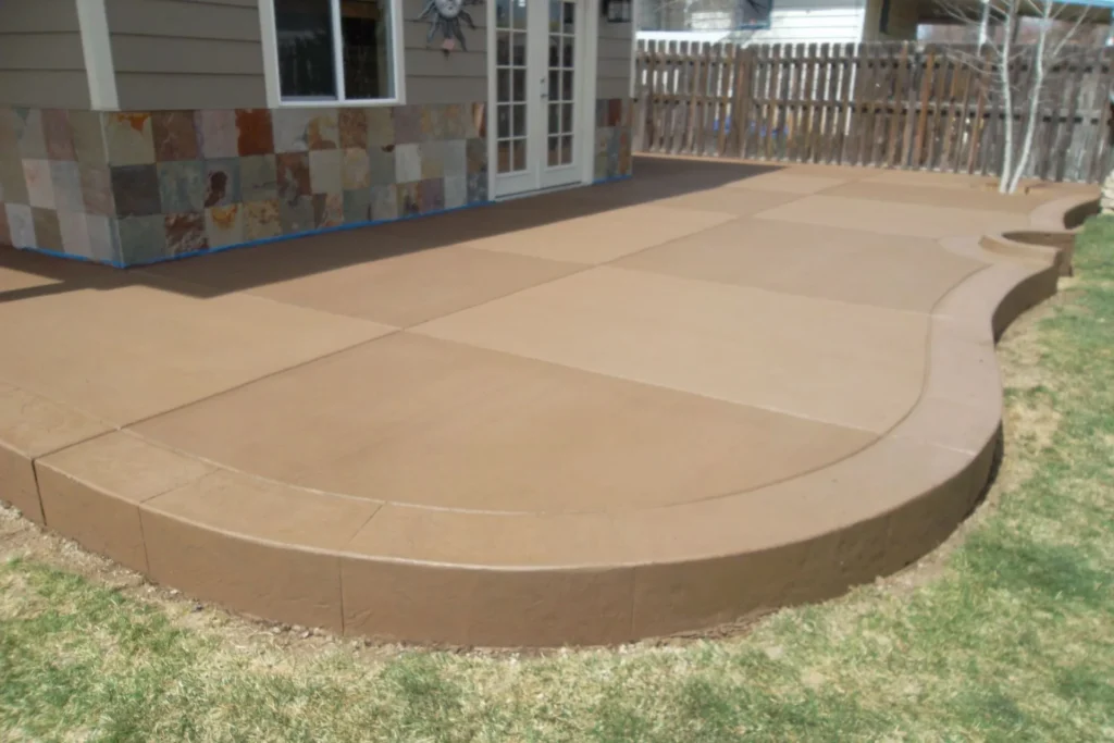 A patio with a concrete slab in the middle of it.